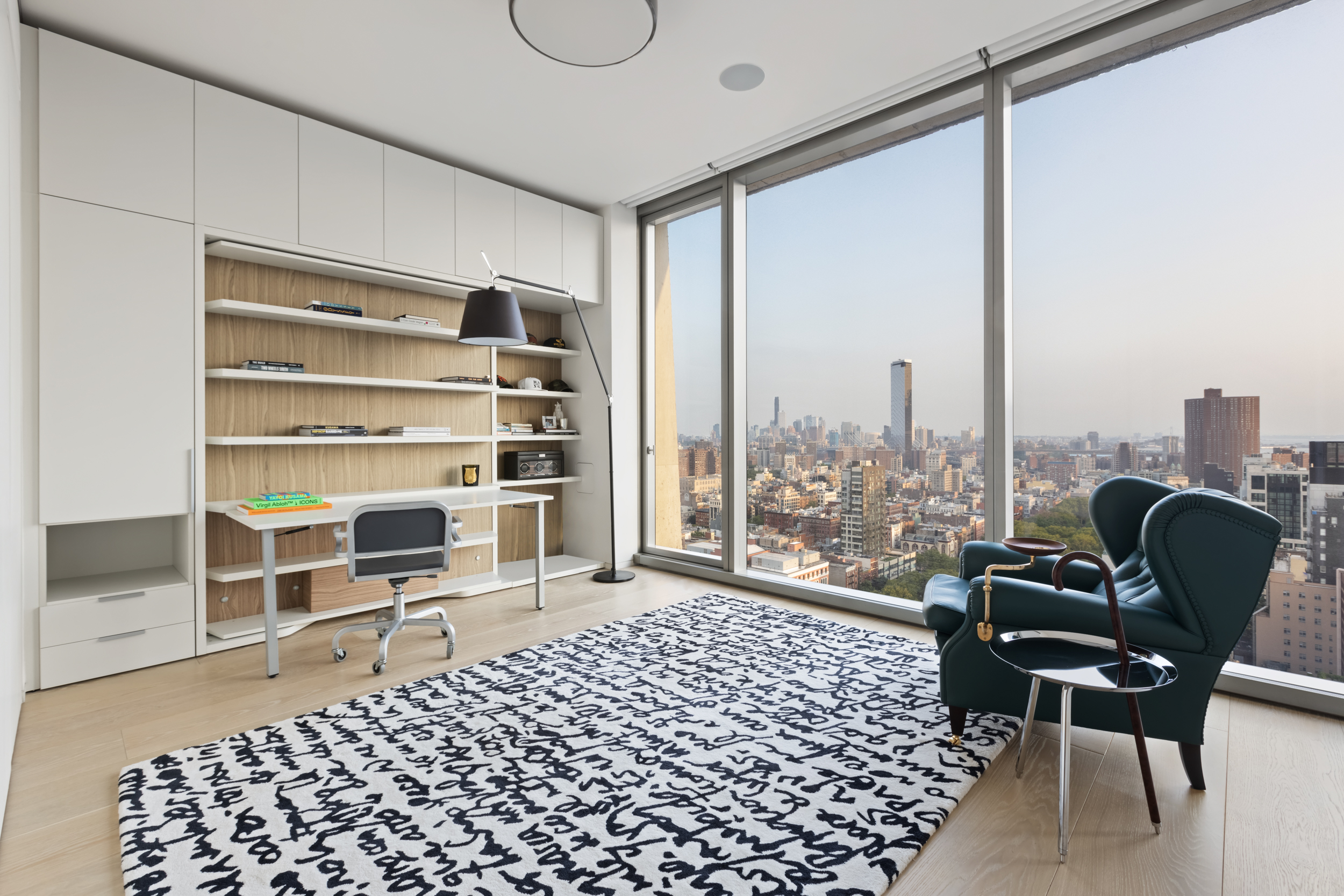 215 Chrystie Street, Unit PH2 Manhattan, NY 10002 - Photo 19 of 30 a chair and a table in a room