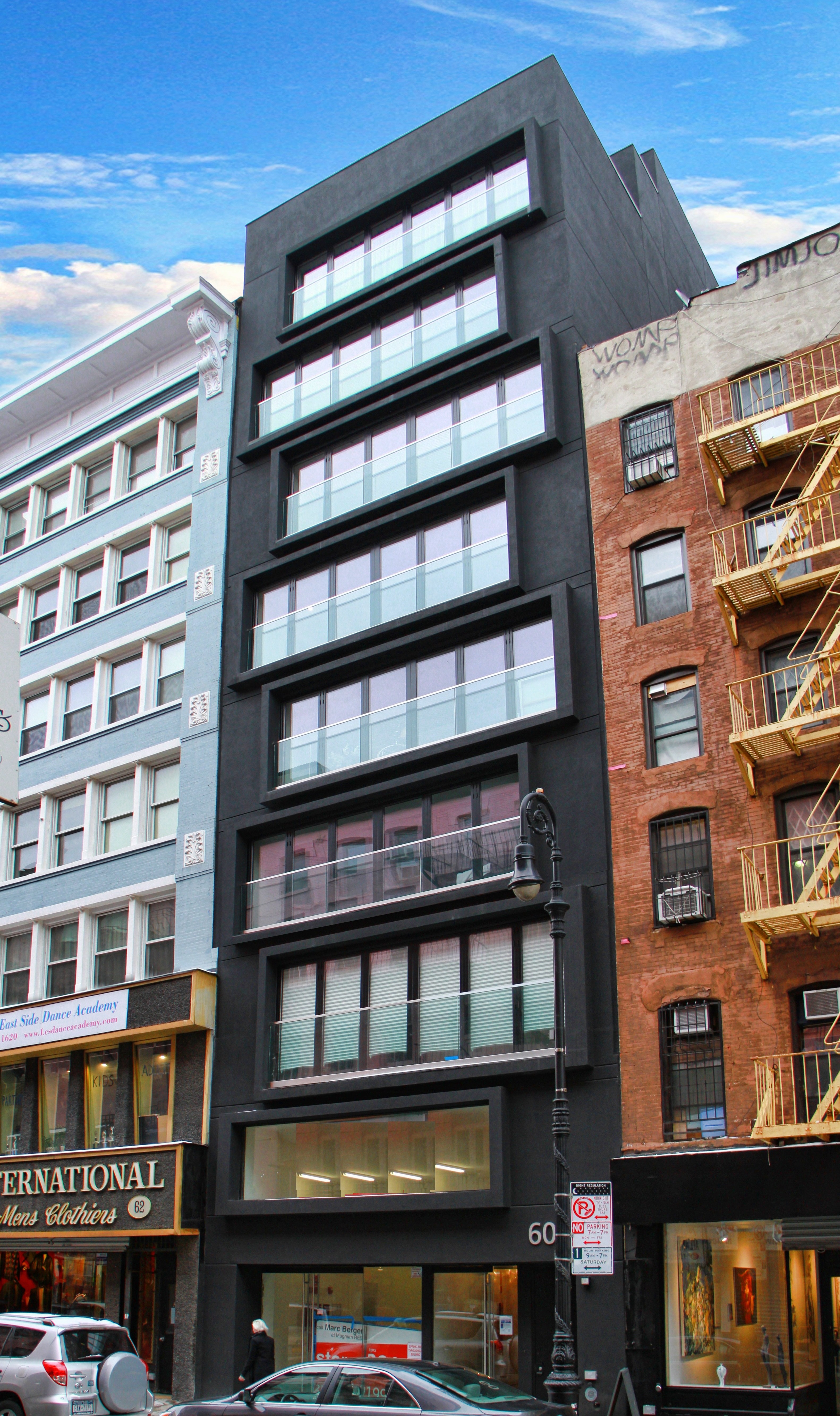 a front view of a building with many windows