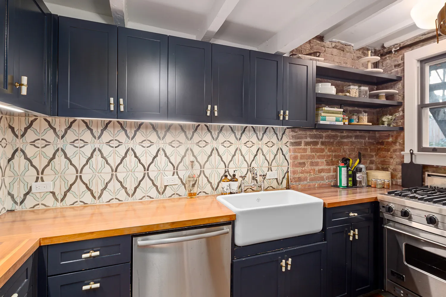 a kitchen with a sink and cabinets
