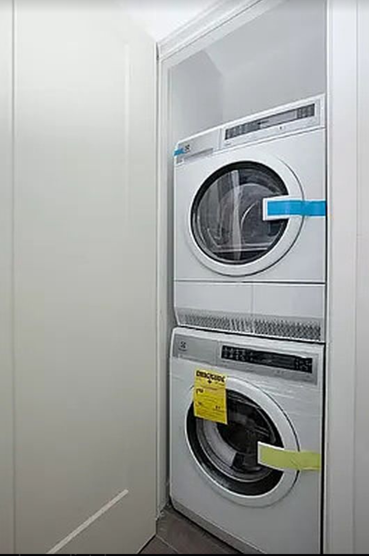 400 East 14th Street, Unit 4C Manhattan, NY 10009 - Photo 5 of 7 a utility room with dryer and washer