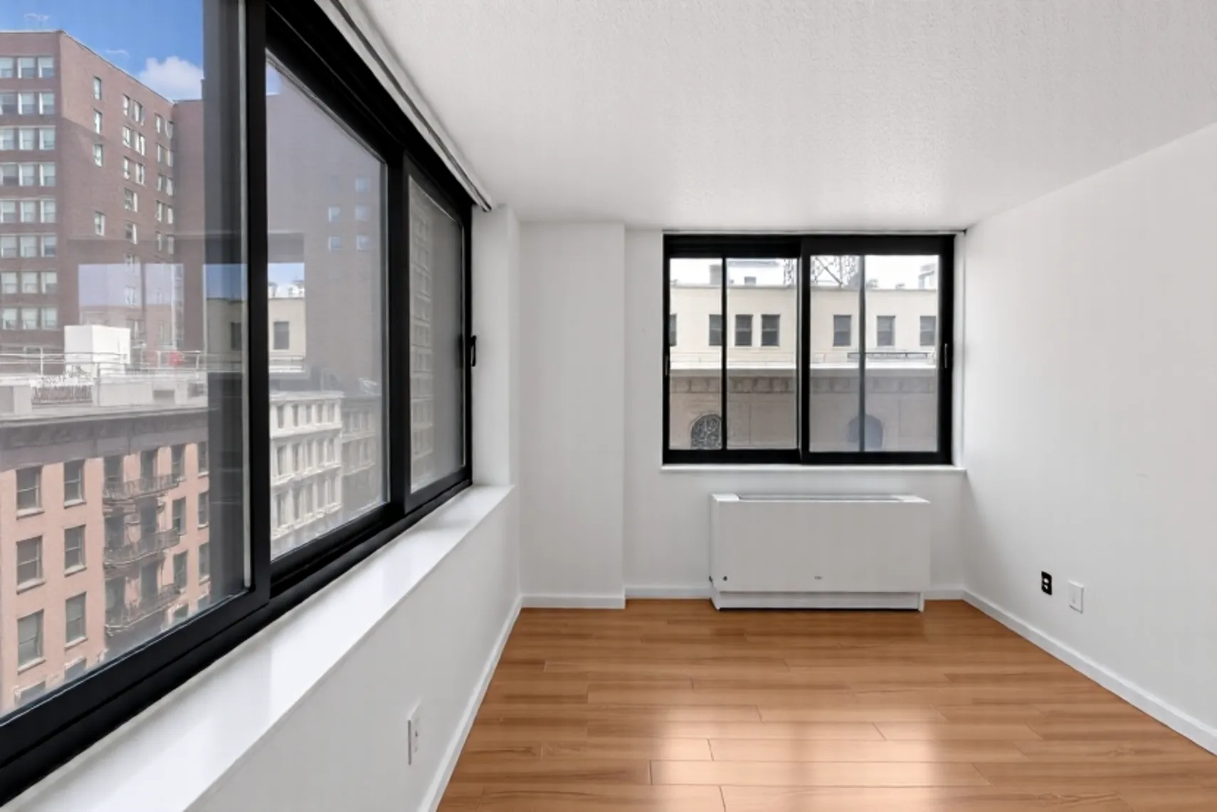 376 Broadway, Unit 8F Manhattan, NY 10013 - Photo 6 of 20 a view of an empty room and window