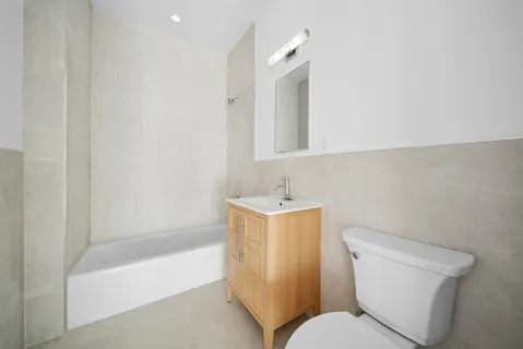 a bathroom with a sink toilet and bathtub