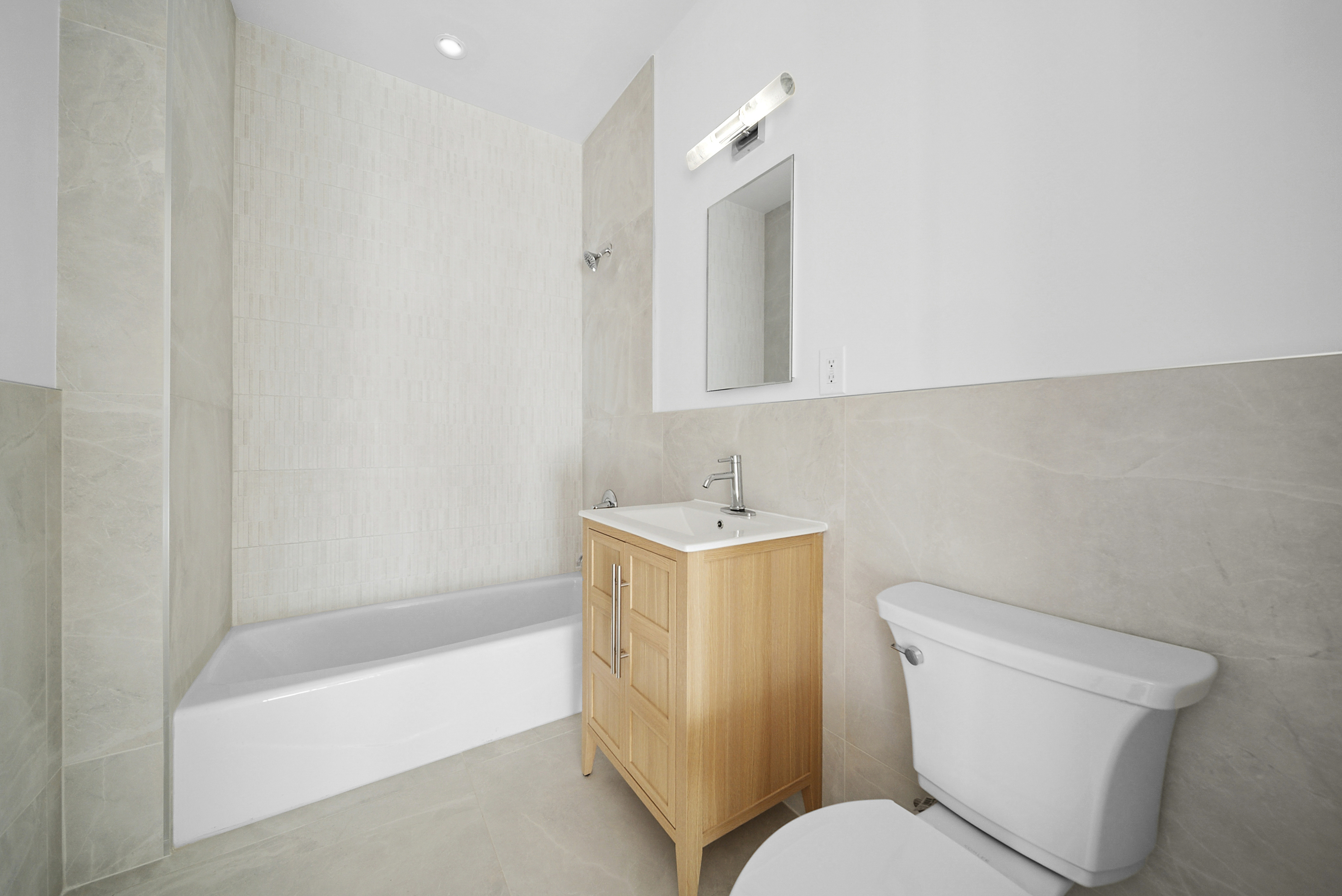 480 Humboldt Street, Unit 3B Brooklyn, NY 11211 - Photo 16 of 19 a bathroom with a sink toilet and bathtub