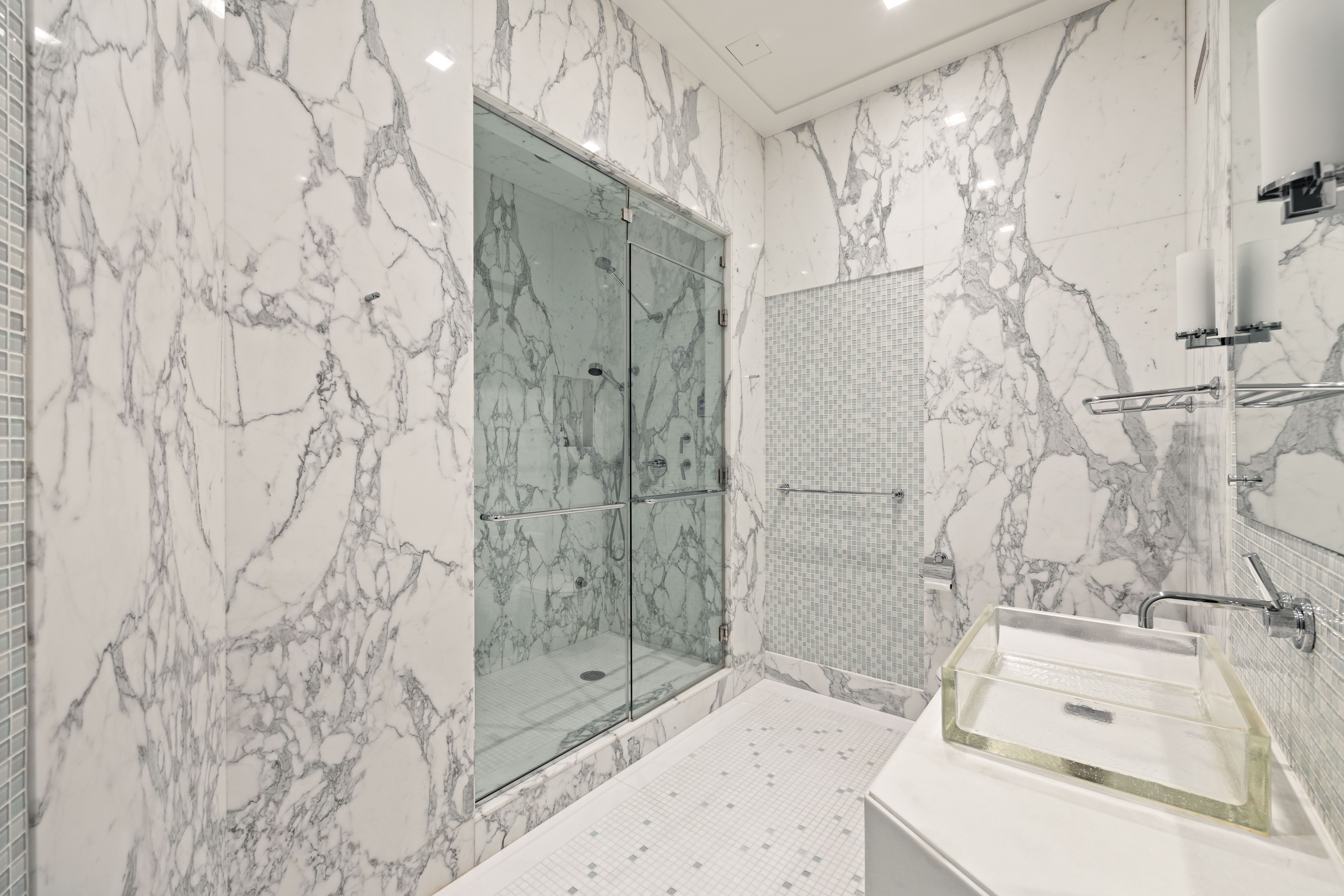 25 Columbus Circle, Unit 75A Manhattan, NY 10019 - Photo 16 of 36 a bathroom with a sink and shower