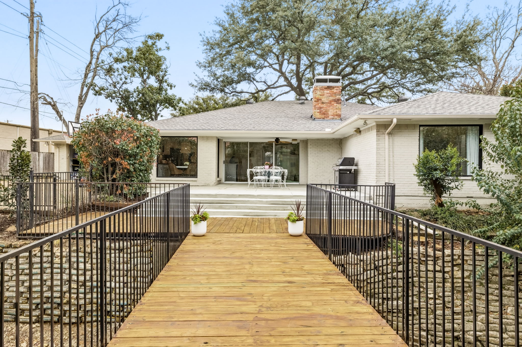 5765 Stonegate Road Dallas, TX 75209 - Photo 33 of 37 a view of a house with a iron gate