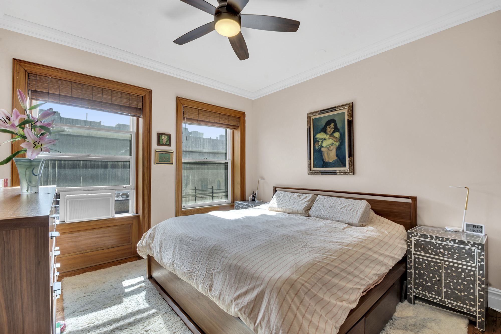 275 Clinton Avenue, Unit 4-1 Brooklyn, NY 11205 - Photo 14 of 20 a bedroom with a large bed and a large window