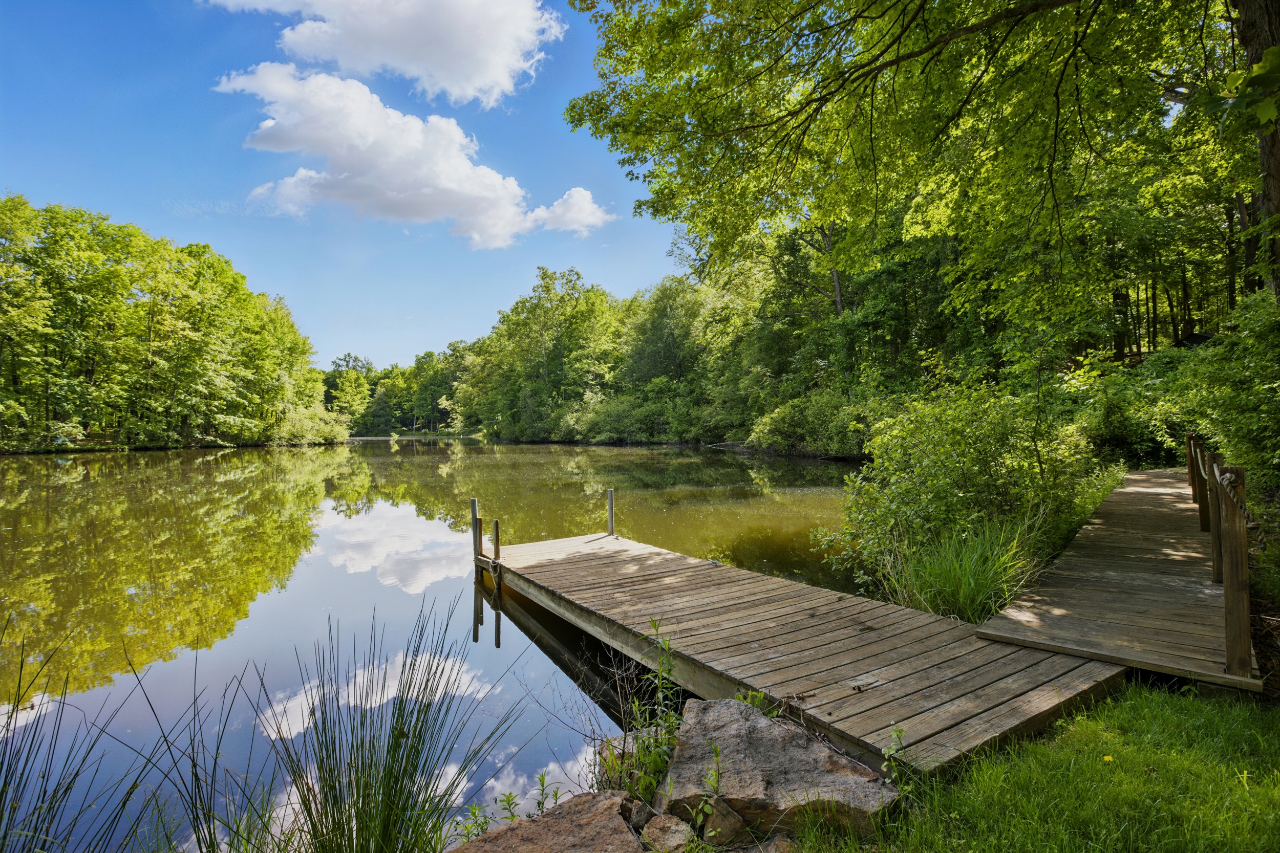 19 Pond Road Cold Spring, NY 10516 - Photo 7 of 32 a view of a wooden deck with lake view