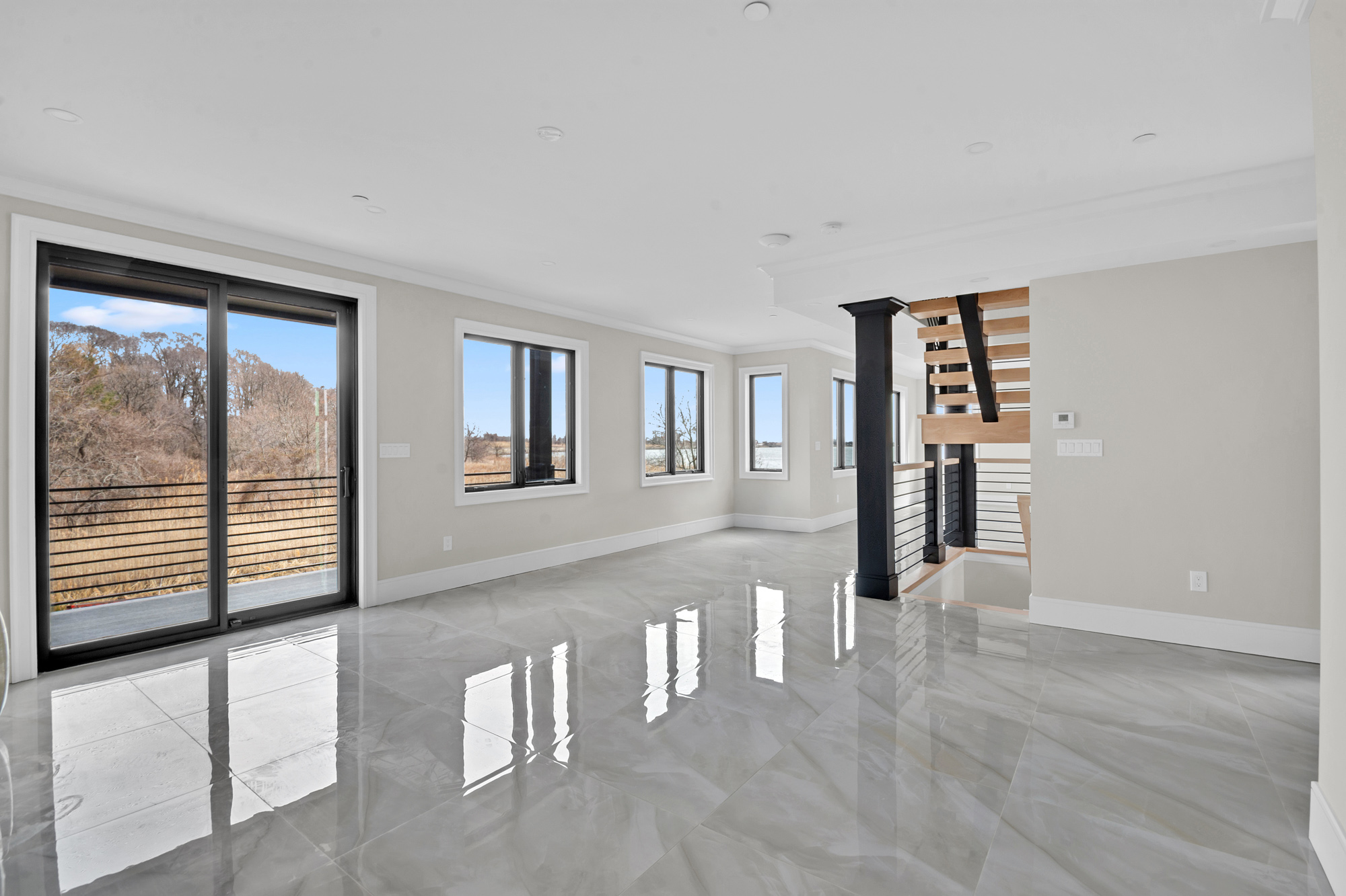 5 Osprey Court Staten Island, NY 10308 - Photo 16 of 50 a view of empty room with wooden floor and fan