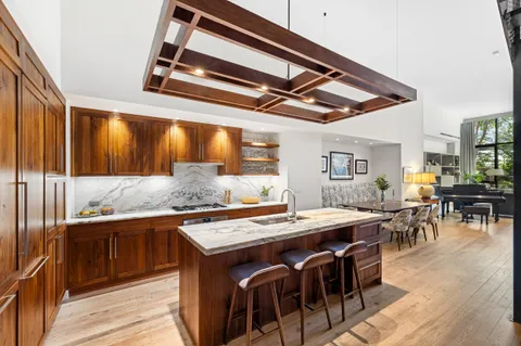 a kitchen with stainless steel appliances granite countertop a stove and a refrigerator