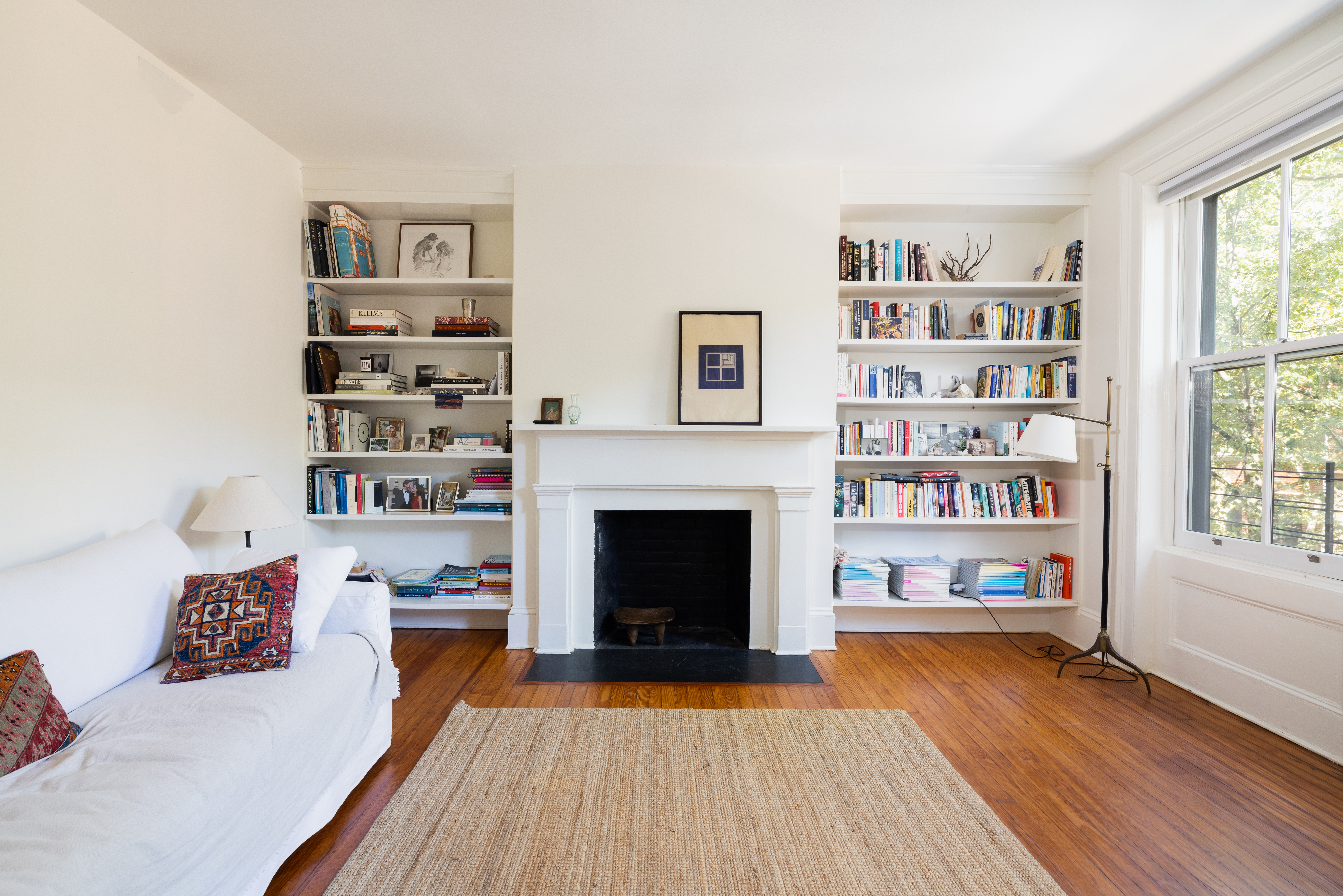188 Warren Street, Unit TRIPLEX Brooklyn, NY 11201 - Photo 8 of 15 a living room with furniture and a fireplace