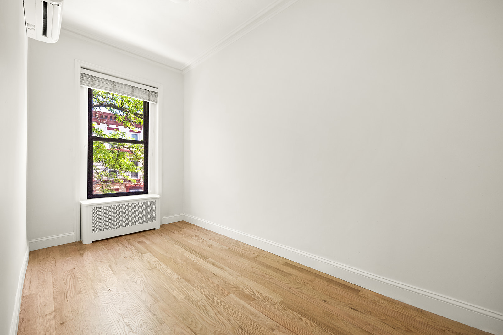 616 Carroll Street, Unit 2 Brooklyn, NY 11215 - Photo 11 of 15 an empty room with wooden floor and windows