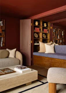 a living room with furniture and lamp