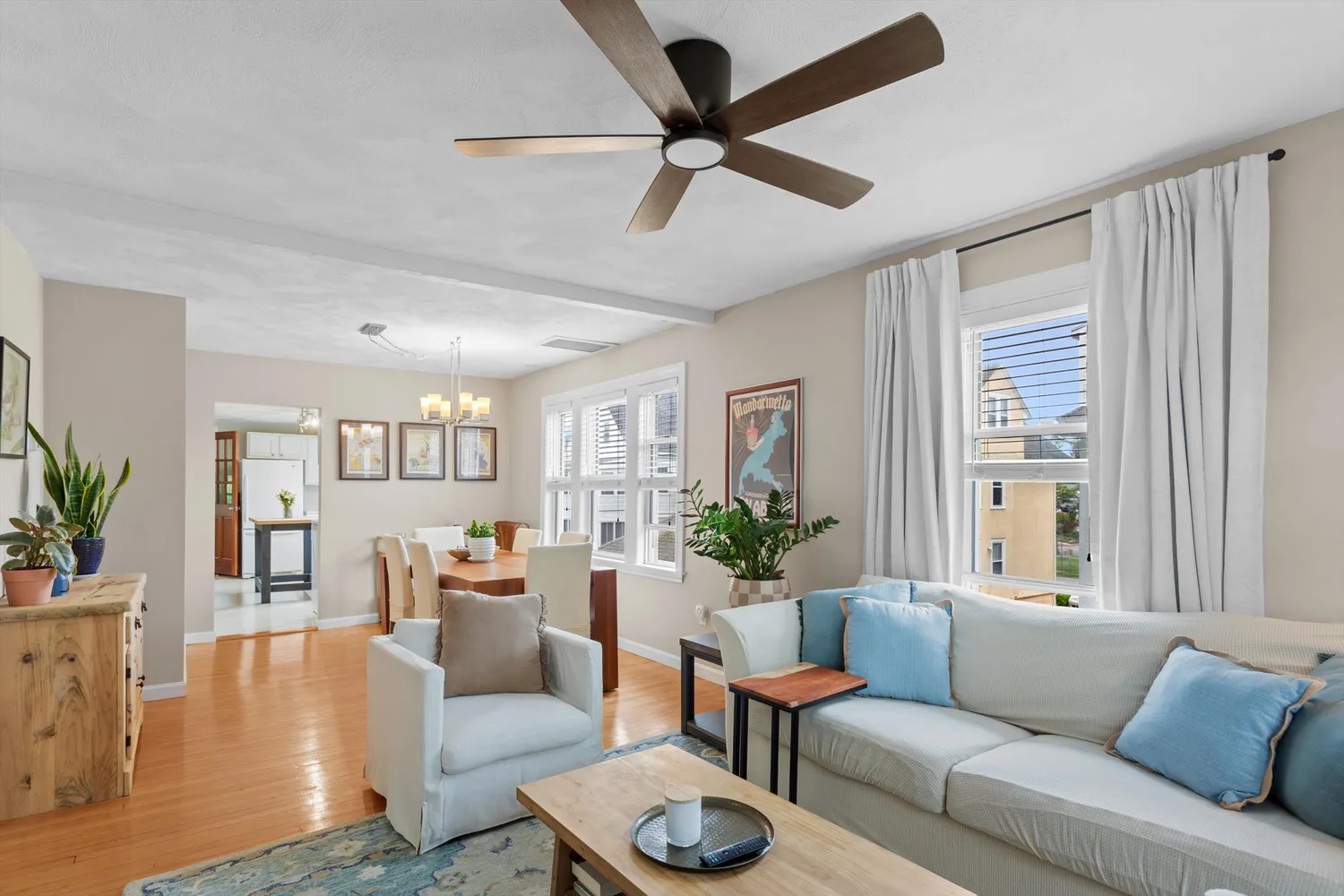 a view of a dining room with furniture window and wooden floor