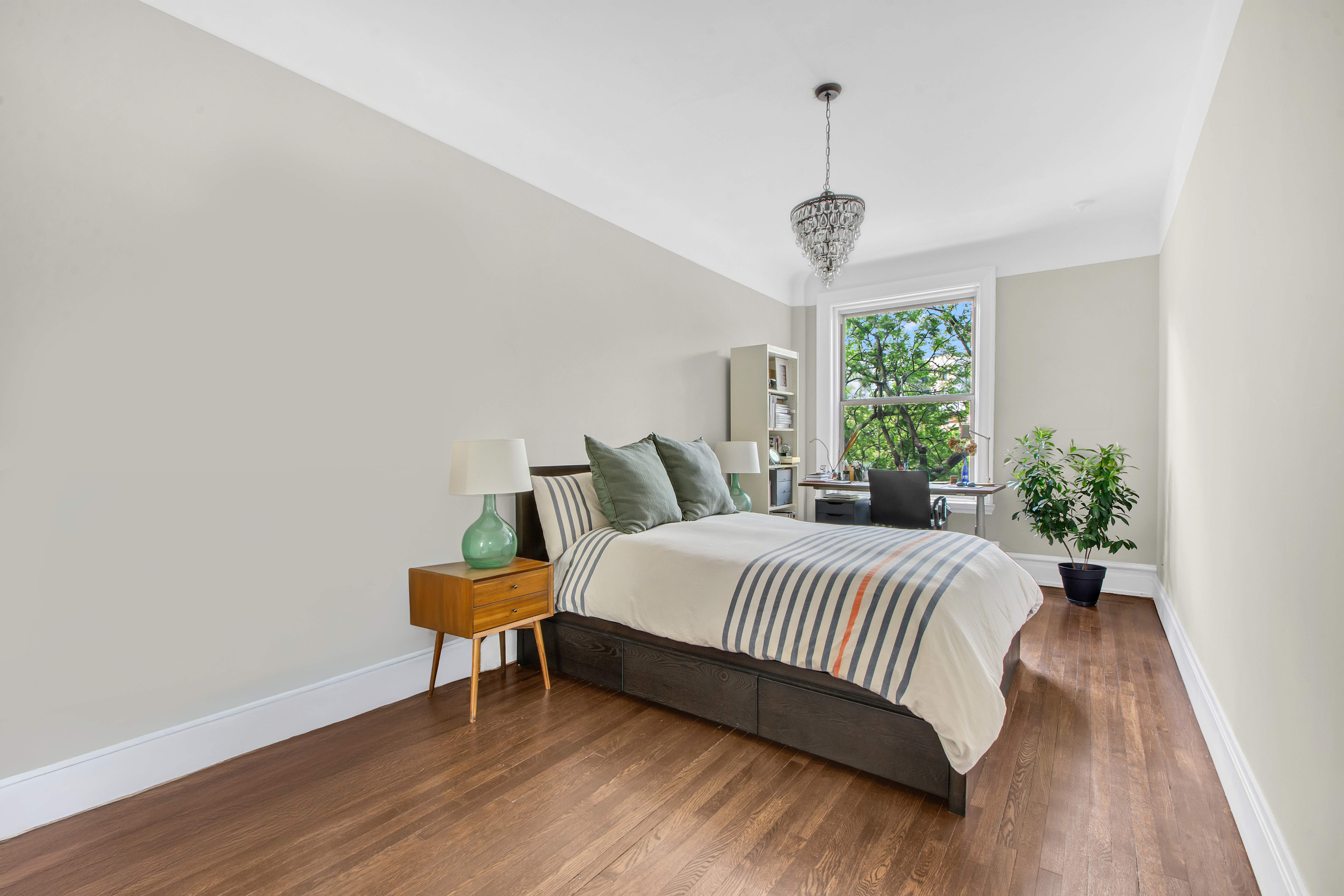 800 Riverside Drive, Unit 2E Manhattan, NY 10032 - Photo 15 of 27 a bedroom with a bed and a window