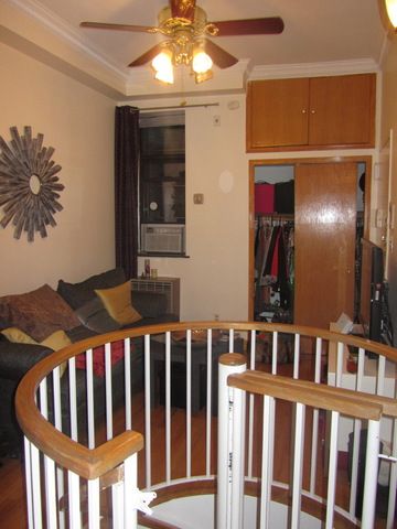 126 East 83rd Street, Unit A2 Manhattan, NY 10028 - Photo 3 of 5 a view of a livingroom with furniture