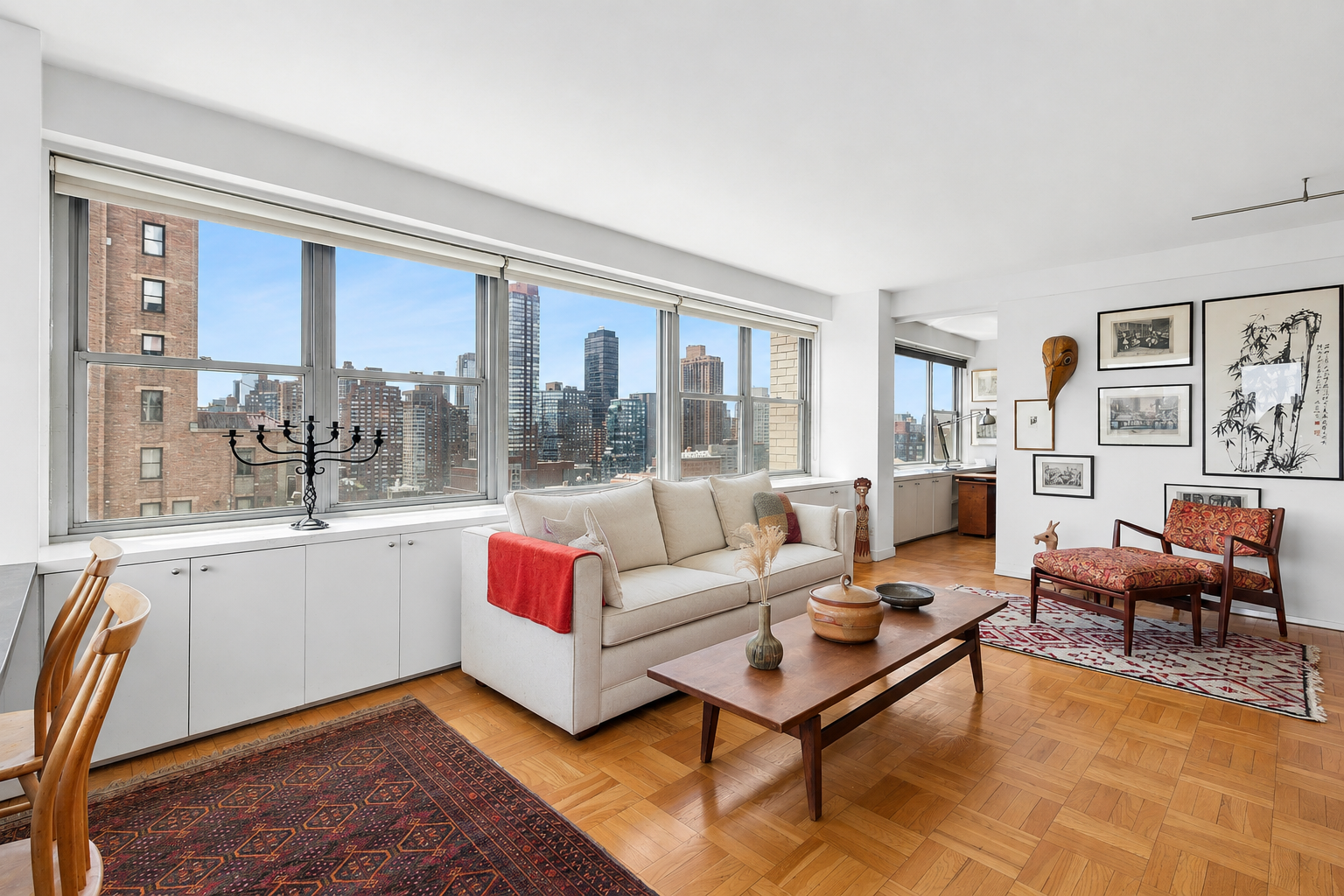 15 West 72nd Street, Unit 25F Manhattan, NY 10023 - Photo 1 of 12 a living room with furniture and a large window