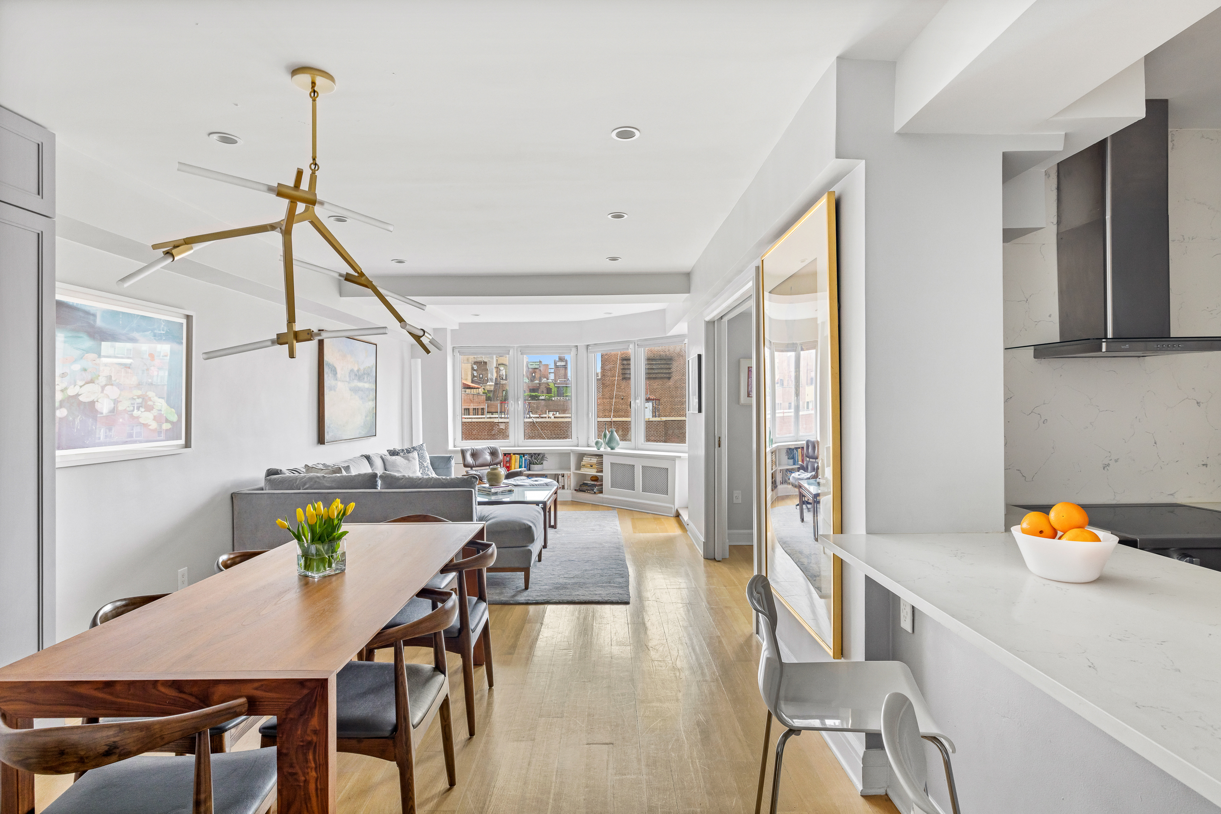 80 East End Avenue, Unit 17C Manhattan, NY 10028 - Photo 4 of 11 a living room with furniture and a table