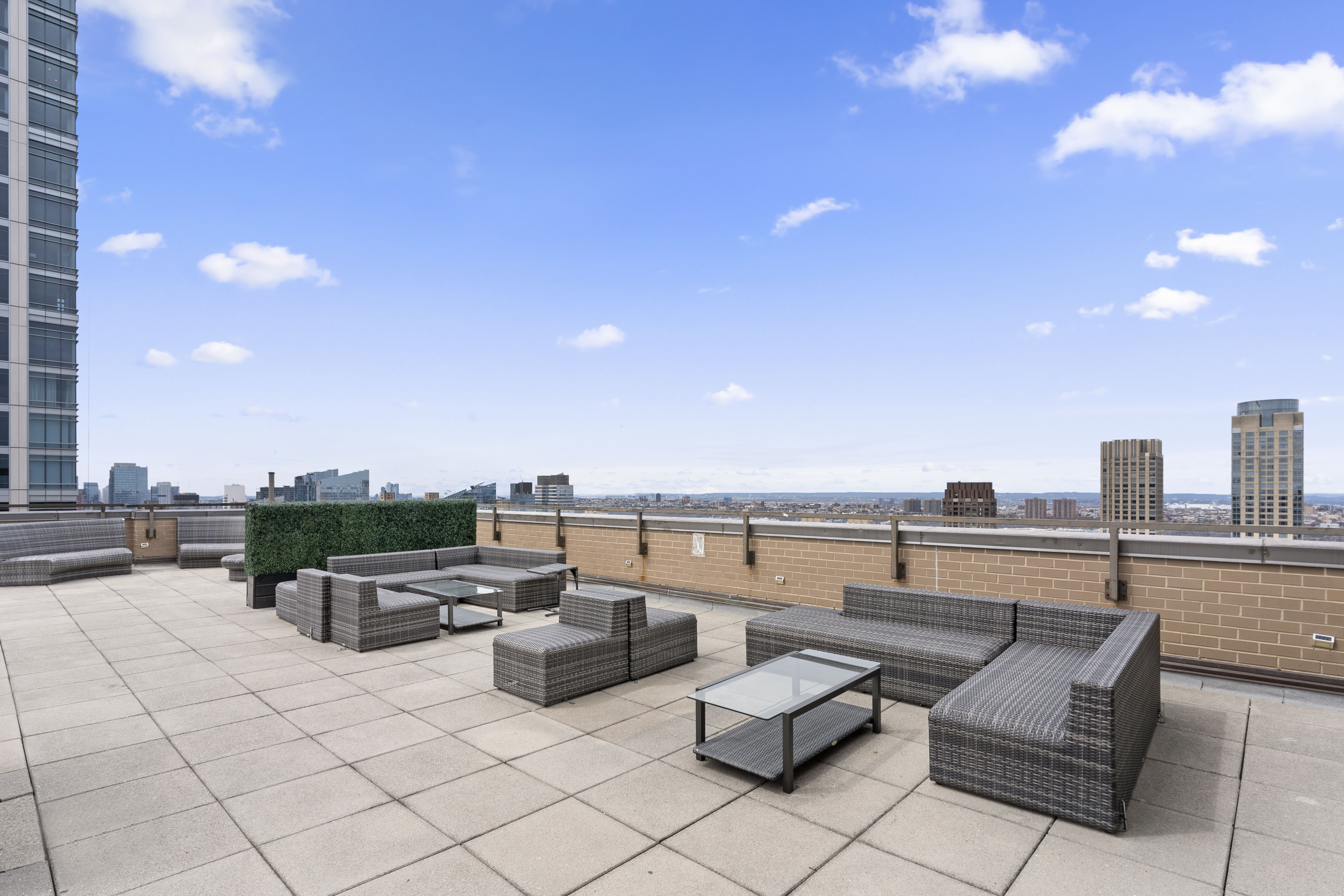 201 West 70th Street, Unit 7H Manhattan, NY 10023 - Photo 9 of 15 a terrace with outdoor seating and city view
