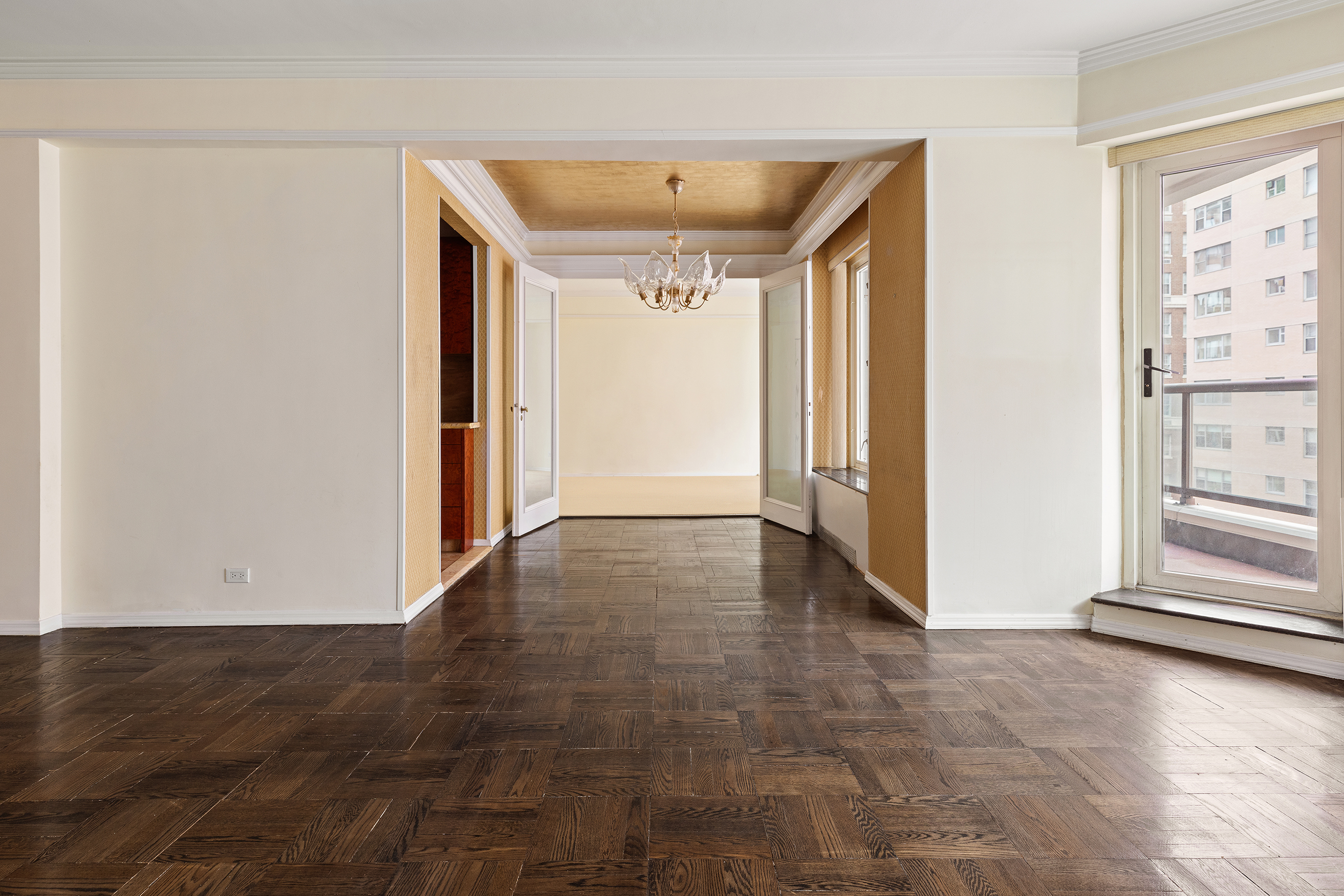 36 Sutton Place South, Unit 10B Manhattan, NY 10022 - Photo 5 of 16 an empty room with wooden floor and windows