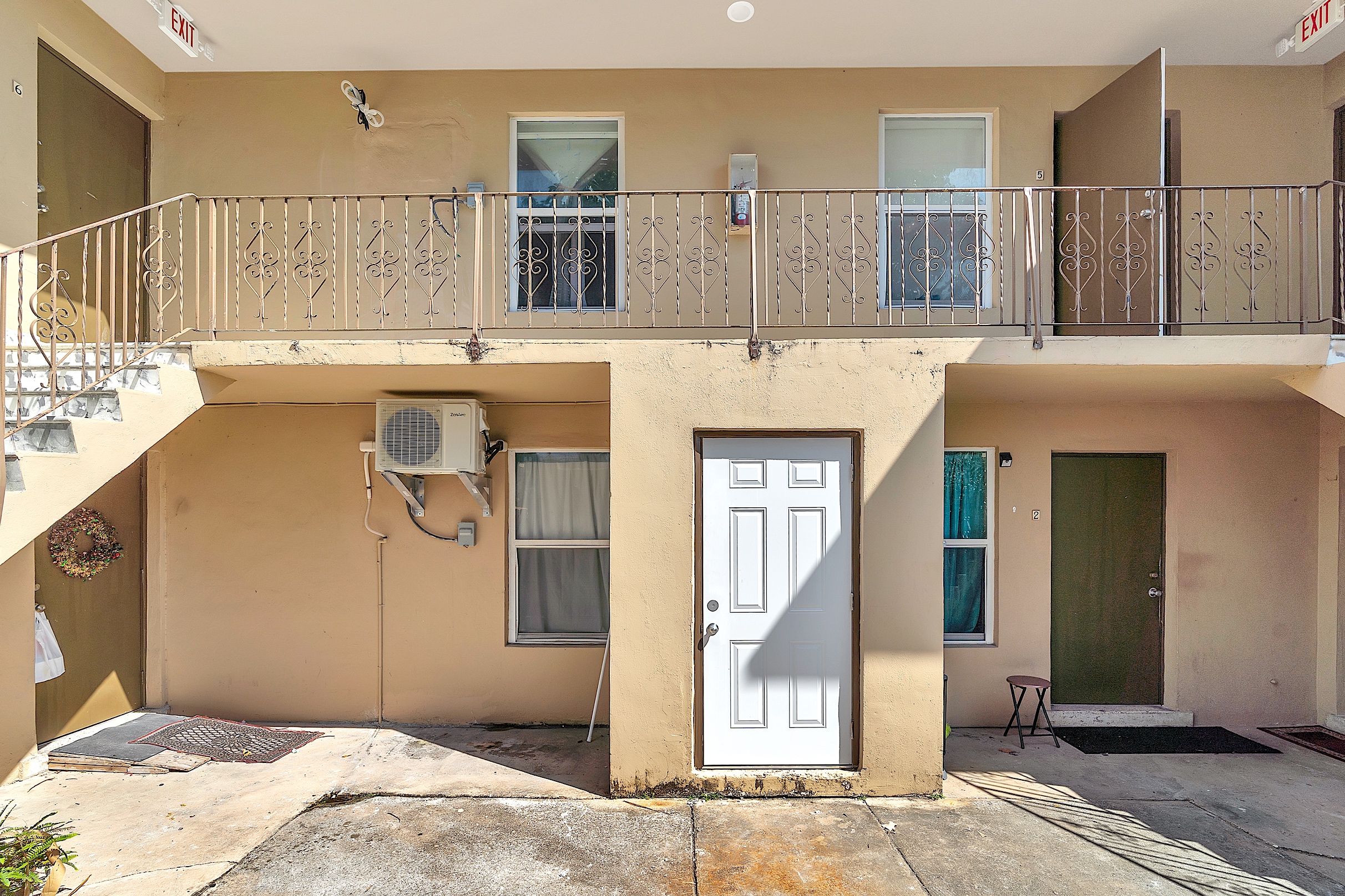 1361 Southwest 4th Street Miami, FL 33135 - Photo 16 of 23 a bedroom with a bed and a mirror on the wall