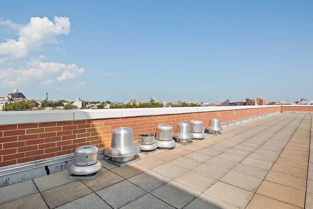 30-85 Vernon Boulevard, Unit 3M Queens, NY 11102 - Photo 7 of 8 a bathroom with a toilet