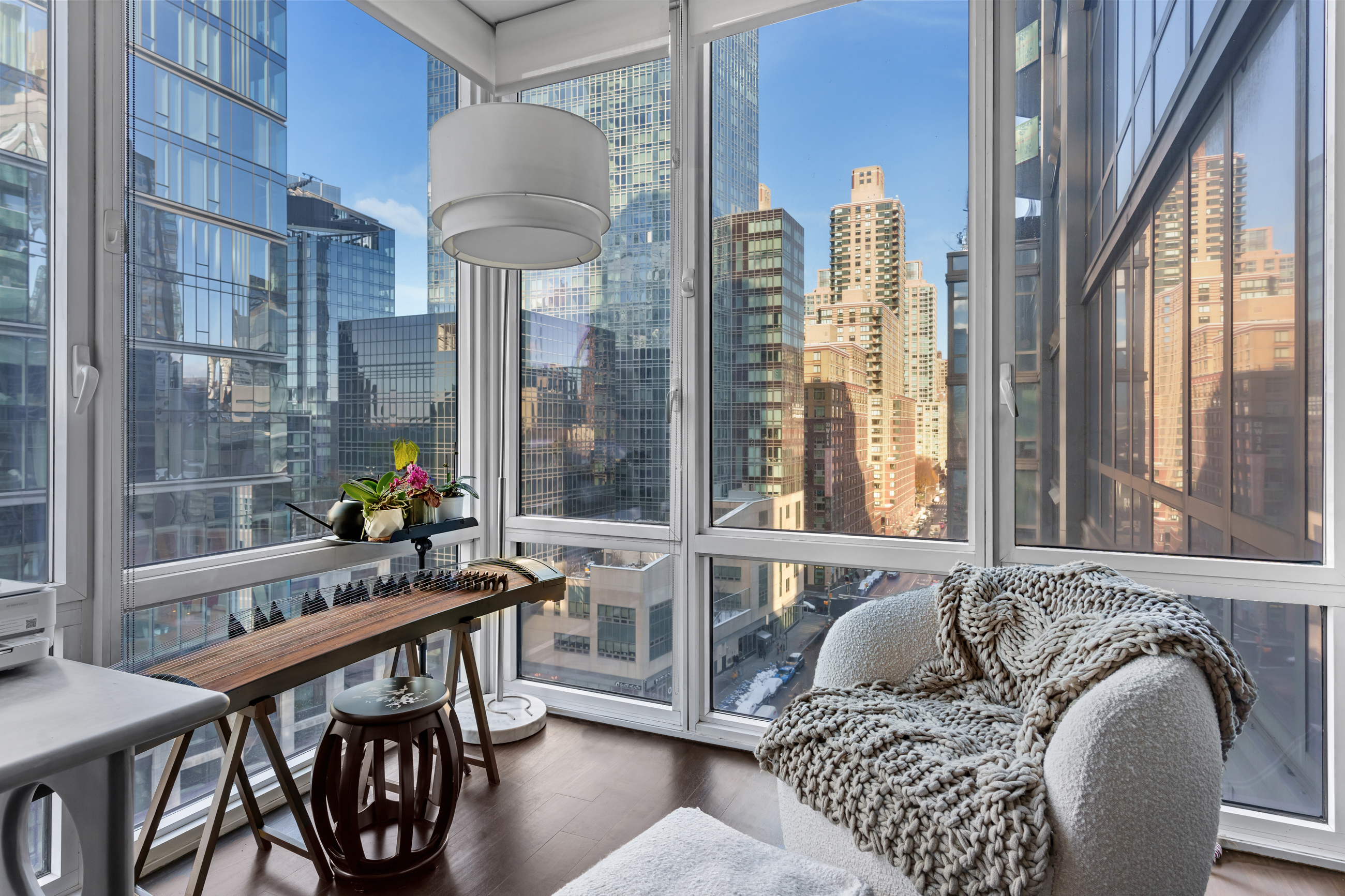 10 West End Avenue, Unit 11G Manhattan, NY 10023 - Photo 4 of 9 a living room with furniture and a large window
