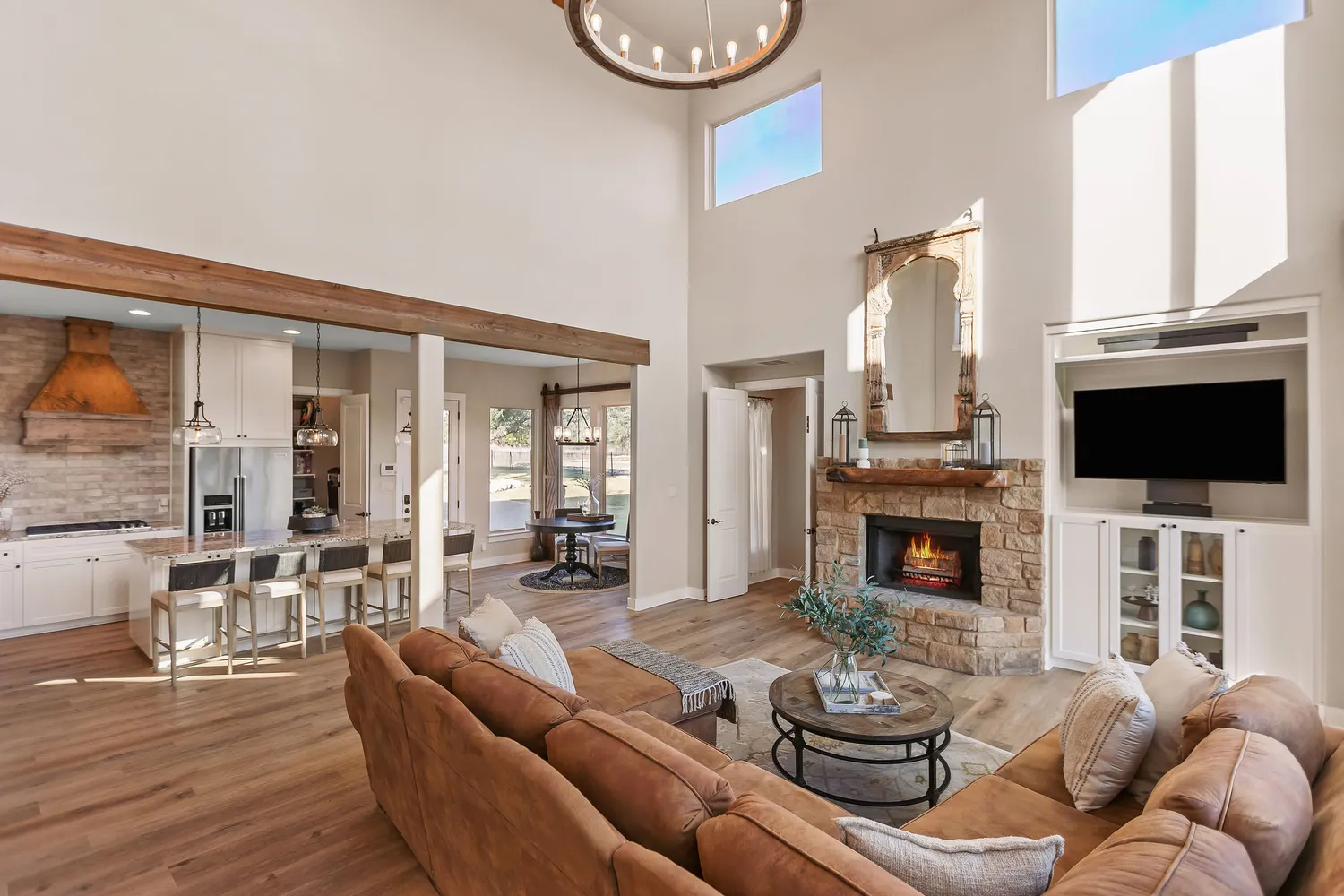 a bathroom with a granite countertop sink and a large mirror