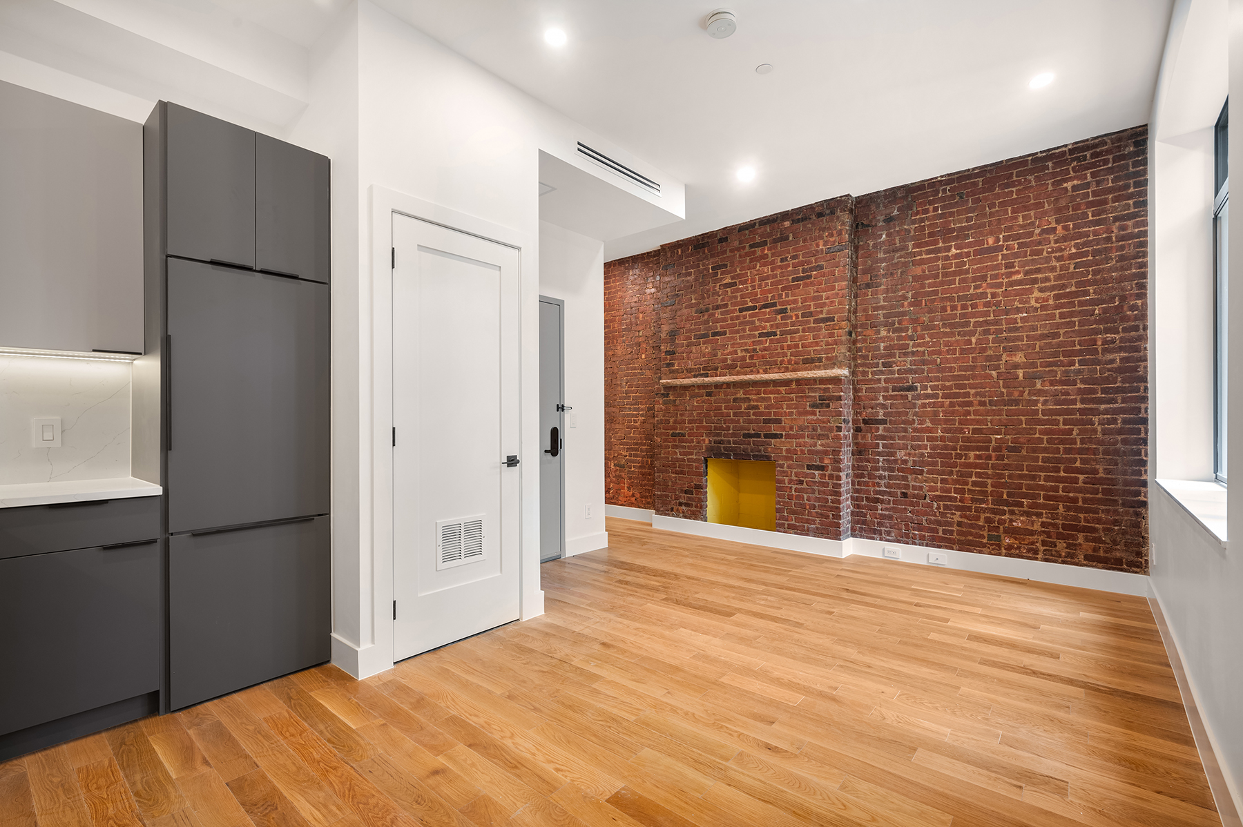 61 West 70th Street, Unit 2B Manhattan, NY 10023 - Photo 2 of 7 a view of an empty room with a fireplace