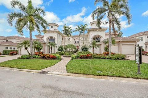 front view of a house with a garden