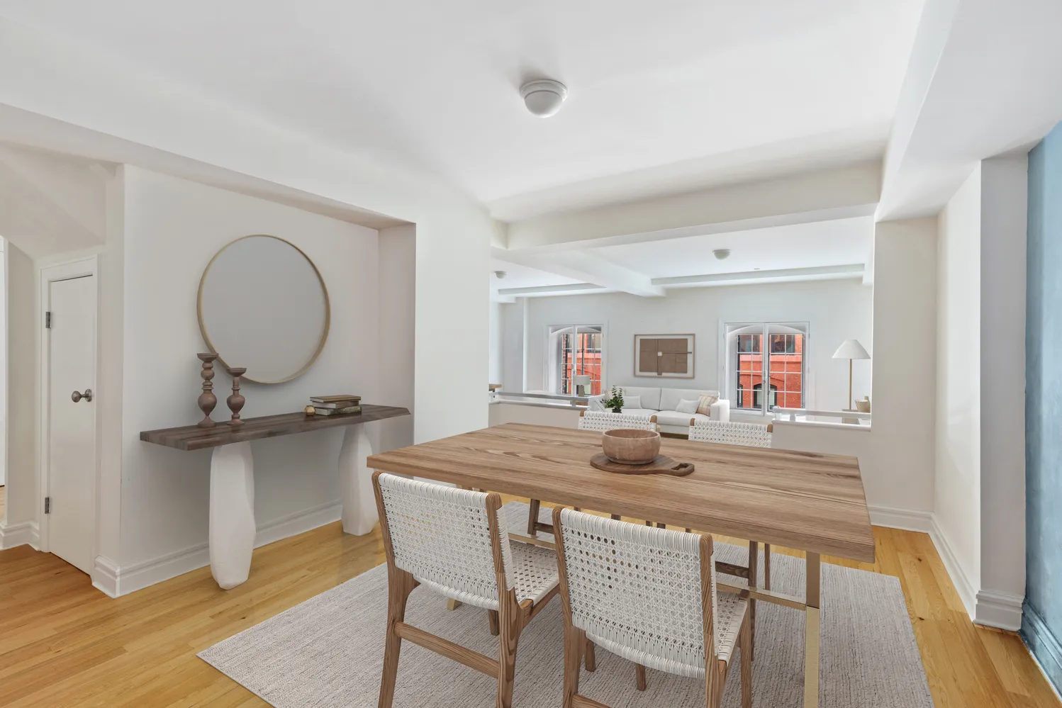 a dining room with kitchen island a table and chairs in it