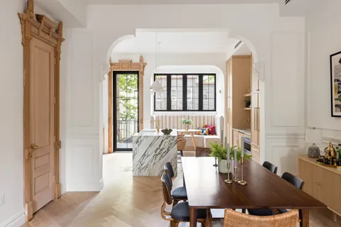 a view of a dining room with furniture and window