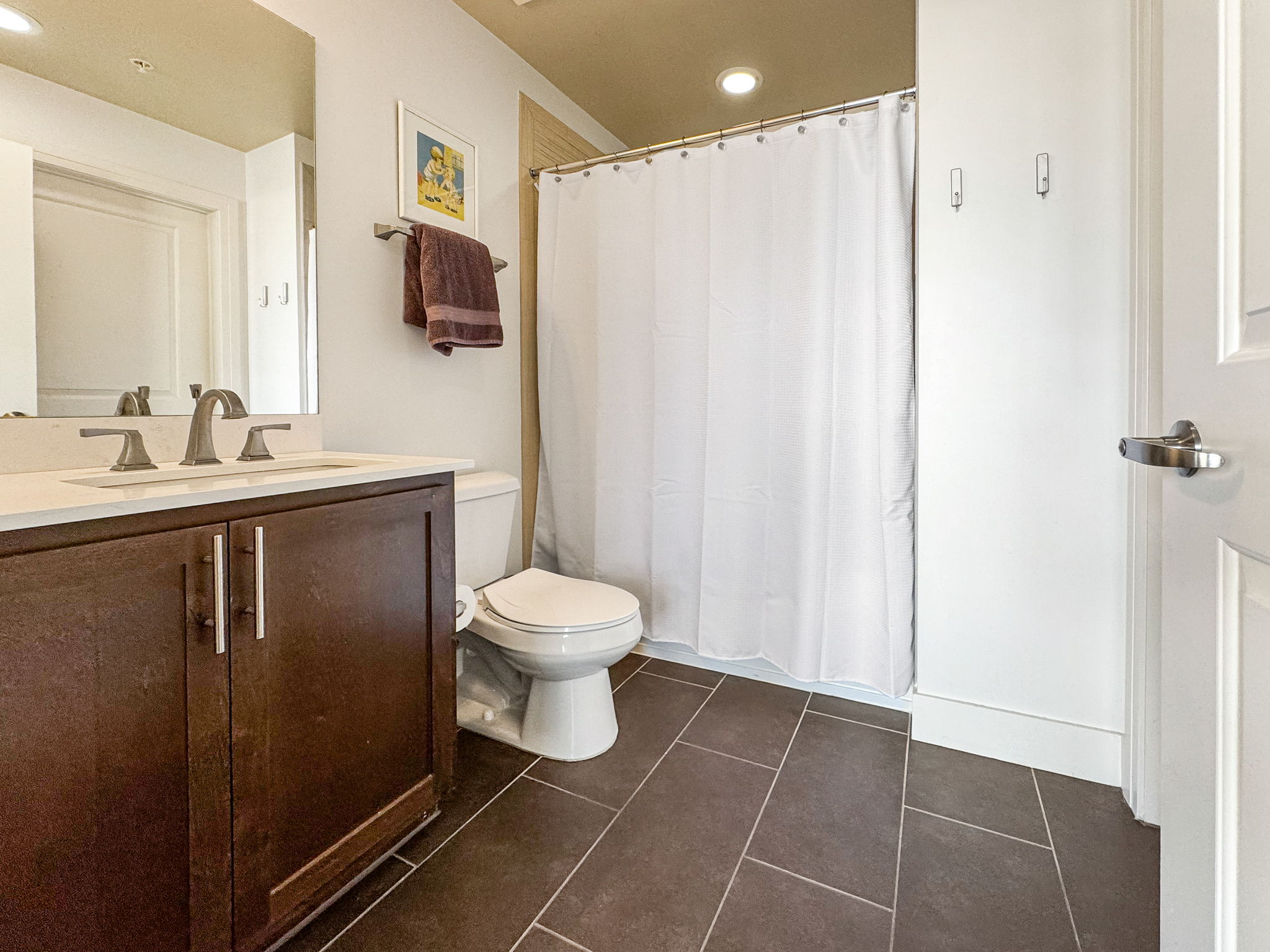 3401 Arapahoe Avenue, Unit Undisclosed Boulder, CO 80303 - Photo 8 of 28 a bathroom with a toilet sink and mirror
