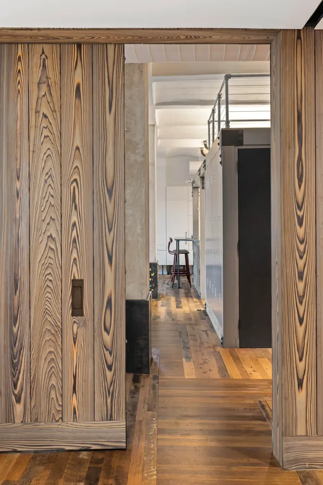a view of a entryway door with wooden floor