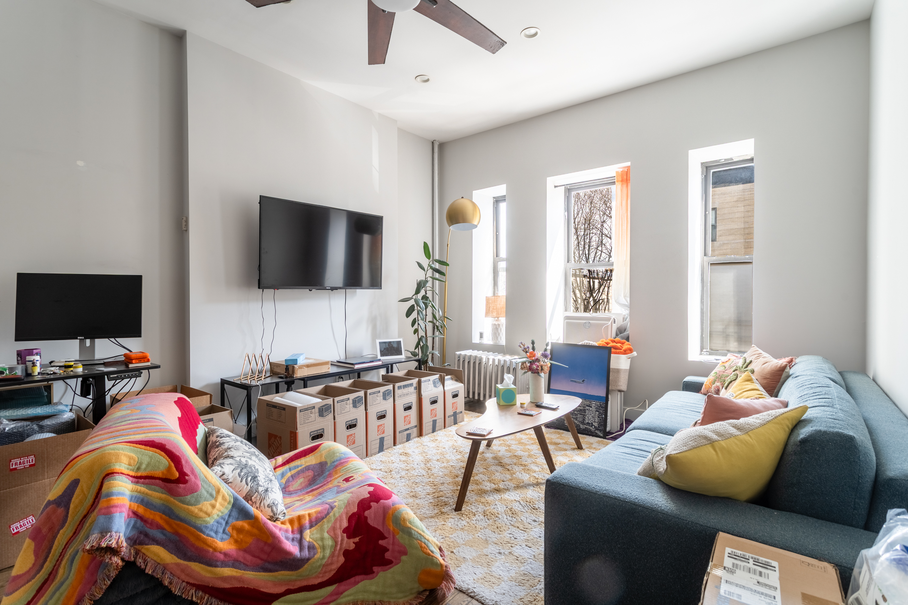 944 Marcy Avenue, Unit 3D Brooklyn, NY 11216 - Photo 3 of 9 a living room with furniture and a flat screen tv