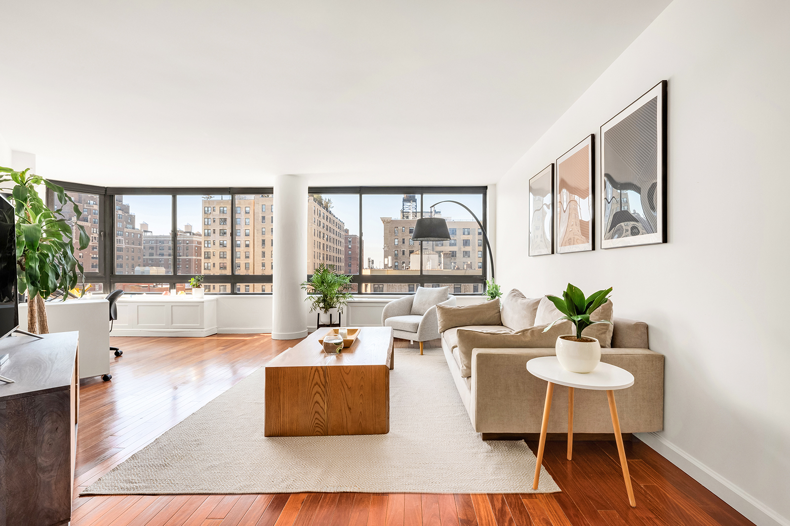 225 West 83rd Street, Unit 8L Manhattan, NY 10024 - Photo 1 of 18 a living room with furniture and a large window