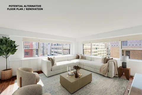 a living room with furniture potted plant and a large window
