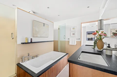 a kitchen with a sink refrigerator and cabinets