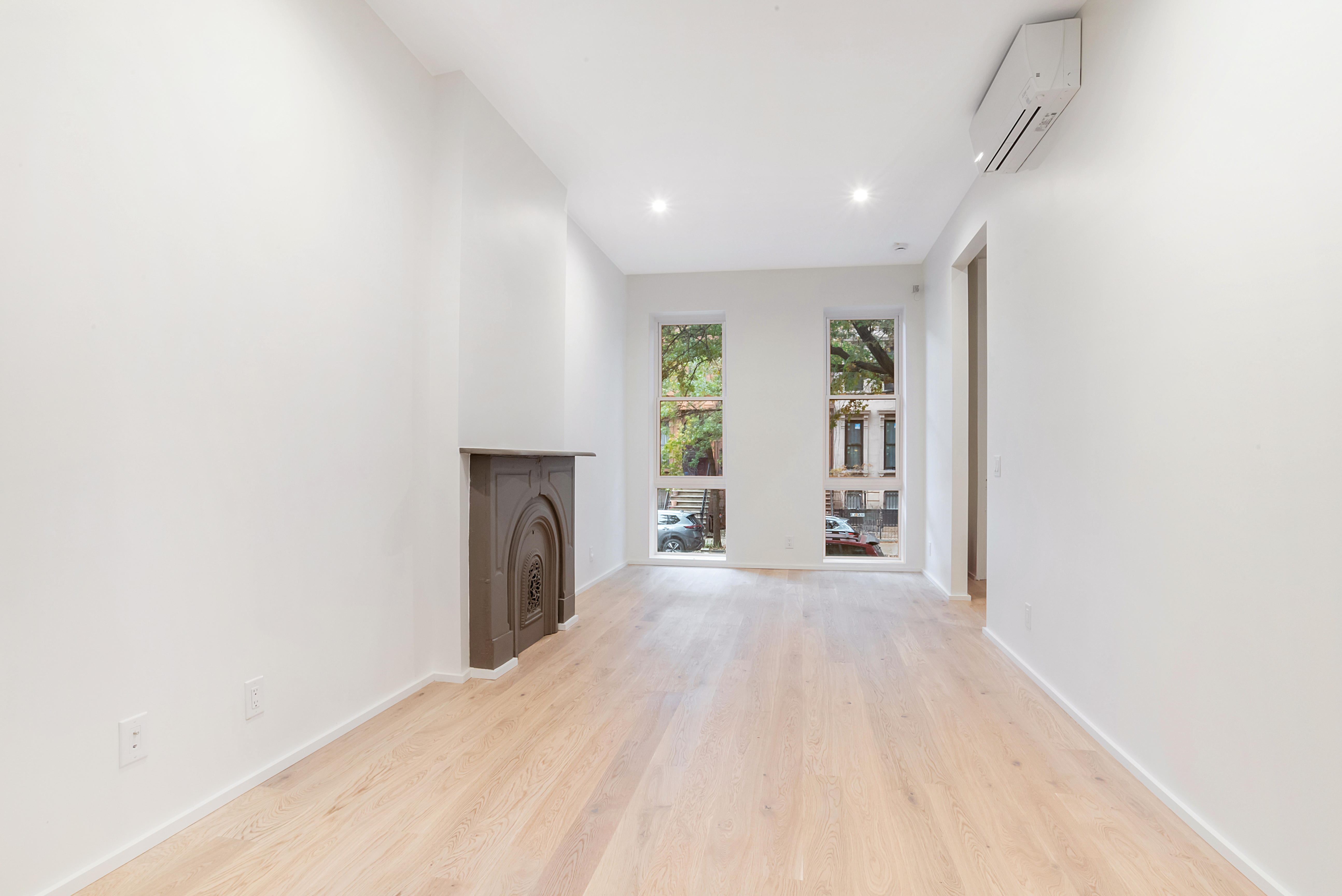 42 Monroe Street, Unit 2 Brooklyn, NY 11238 - Photo 3 of 19 a view of a livingroom with a fireplace