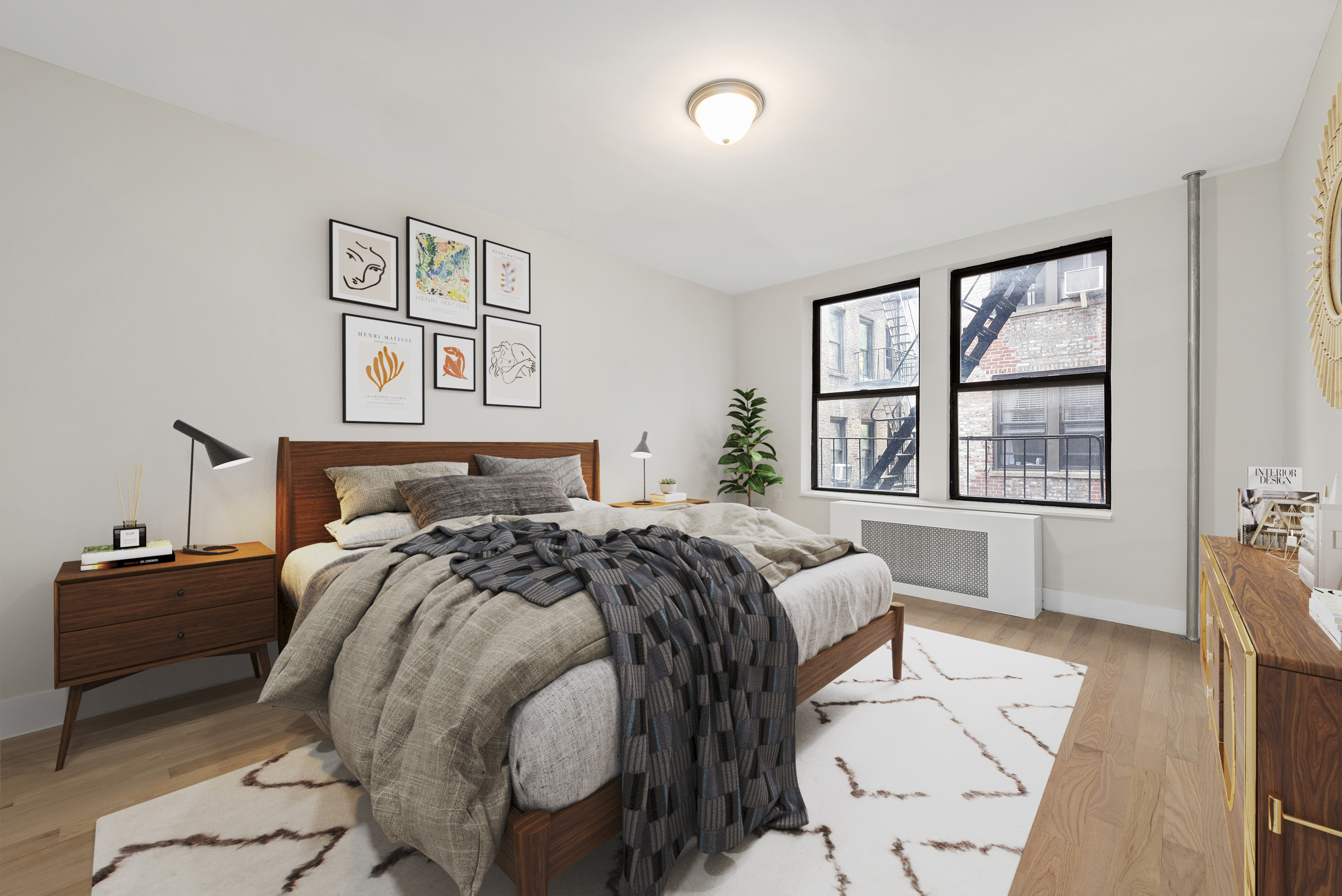 750 Riverside Drive, Unit 3B Manhattan, NY 10031 - Photo 3 of 6 a bed sitting in a bedroom next to a window