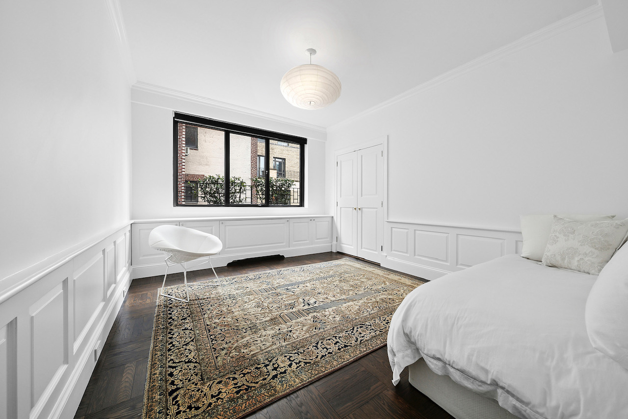 12 Beekman Place, Unit PHA Manhattan, NY 10022 - Photo 10 of 12 a spacious bedroom with a bed and a window