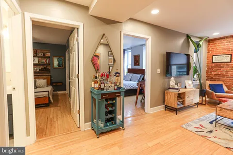 a view of living room kitchen with furniture and a flat screen tv