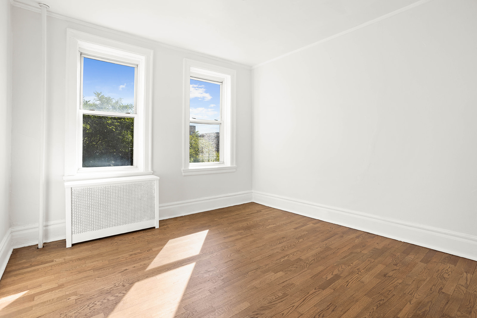 35-55 78th Street, Unit 42 Queens, NY 11372 - Photo 5 of 11 an empty room with windows