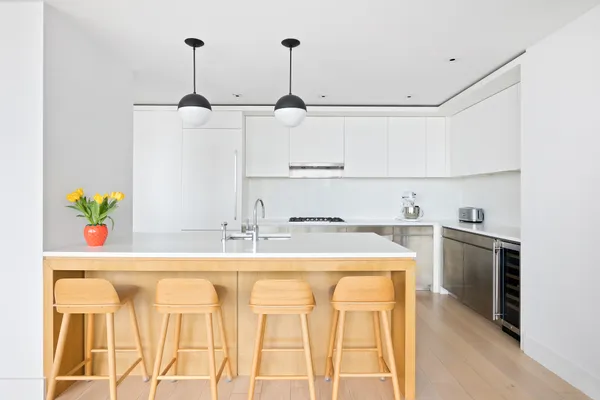 a kitchen with a sink cabinets and appliances