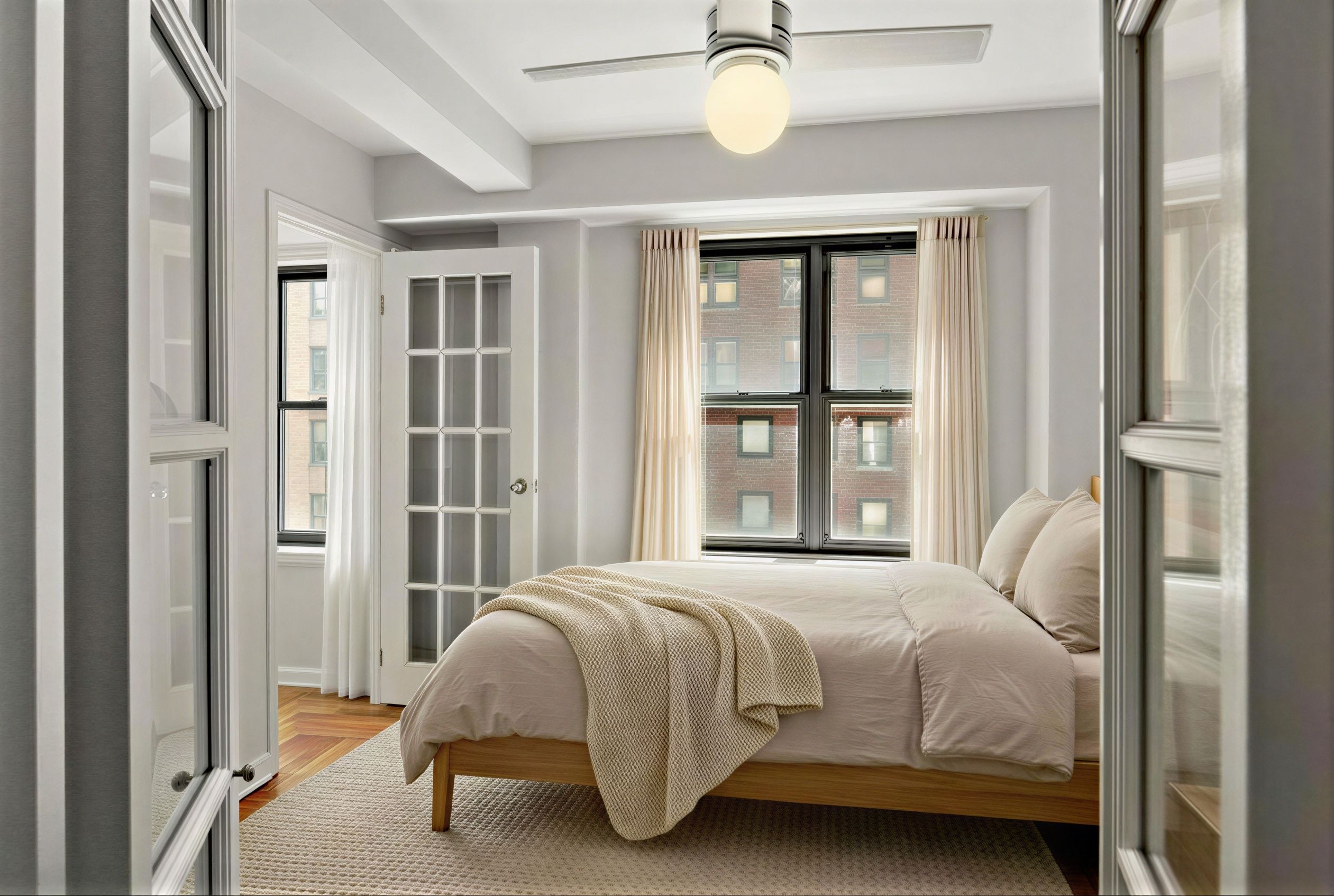 310 Lexington Avenue, Unit 9F Manhattan, NY 10016 - Photo 4 of 12 a bedroom with a bed and a window