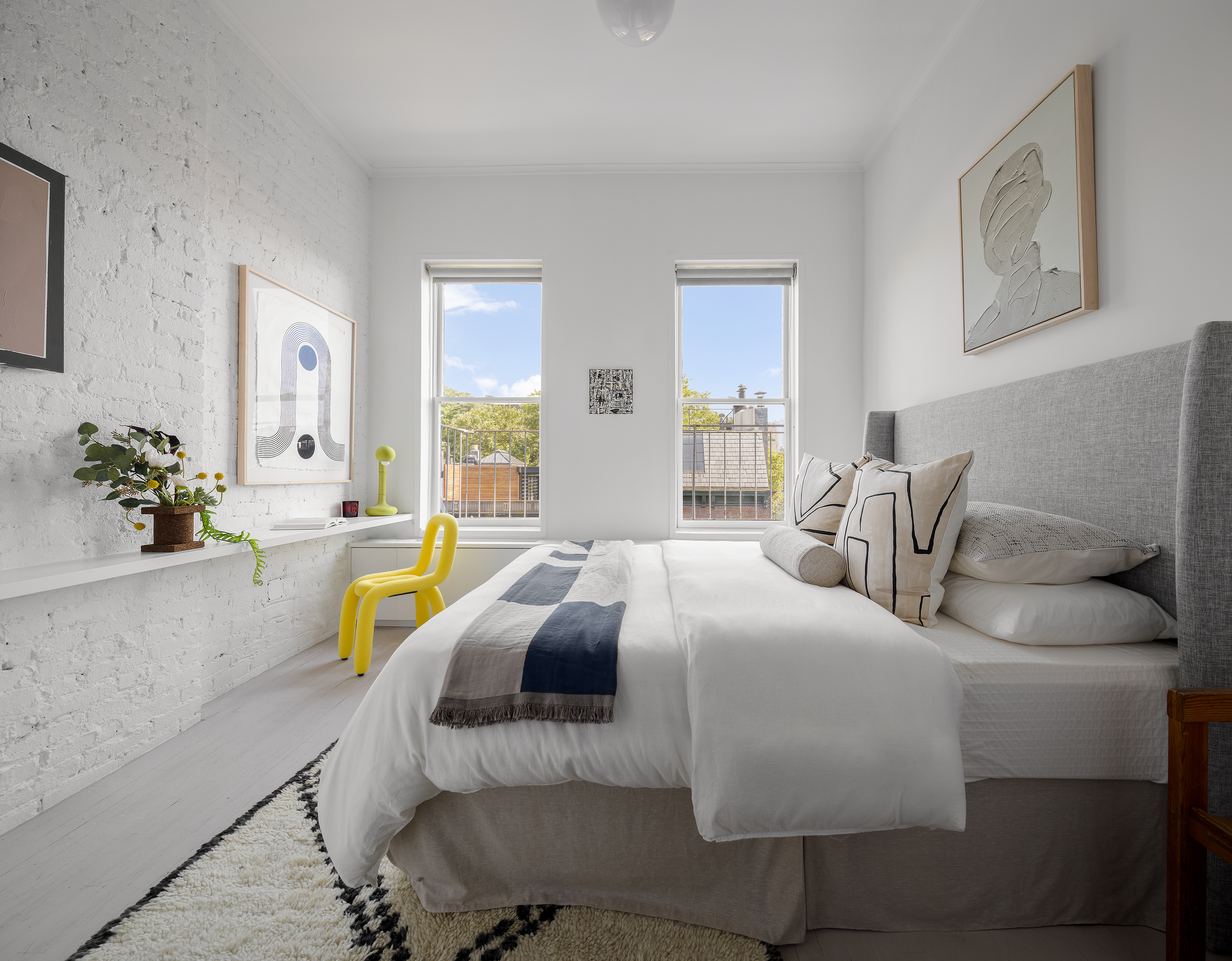281 West 11th Street, Unit 4/5C Manhattan, NY 10014 - Photo 12 of 18 a bedroom with a bed and a couch