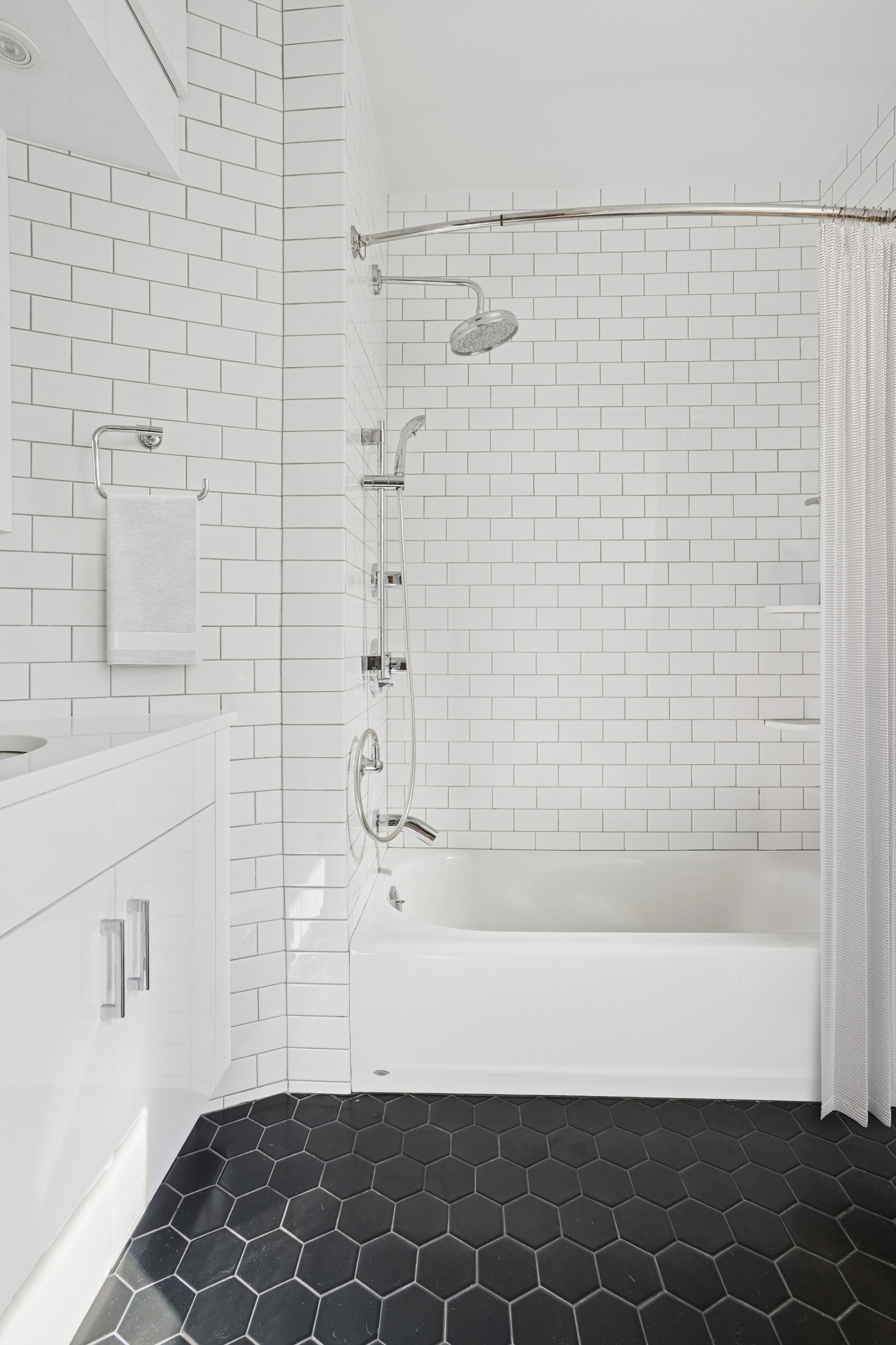333 Central Park West, Unit 115 Manhattan, NY 10025 - Photo 10 of 13 a bathroom with a bathtub and shower