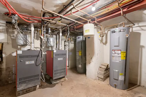 a utility room with refrigerator and washer