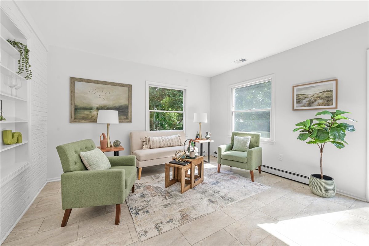 1902 Rookwood Road Silver Spring, MD 20910 - Photo 15 of 36 a living room with furniture potted plant and a window