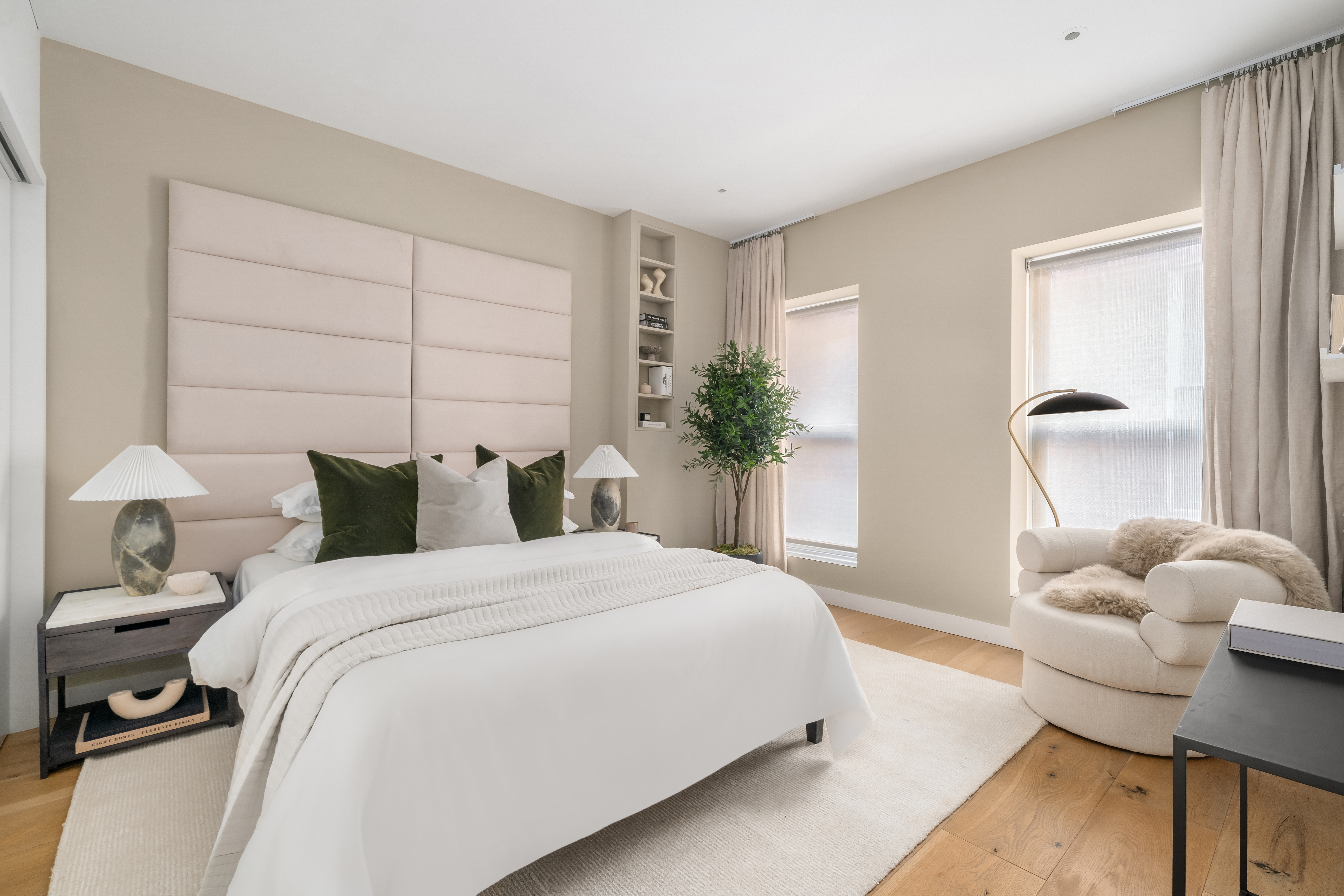 472 Greenwich Street, Unit PH Manhattan, NY 10013 - Photo 10 of 13 a bedroom with bed and a potted plant