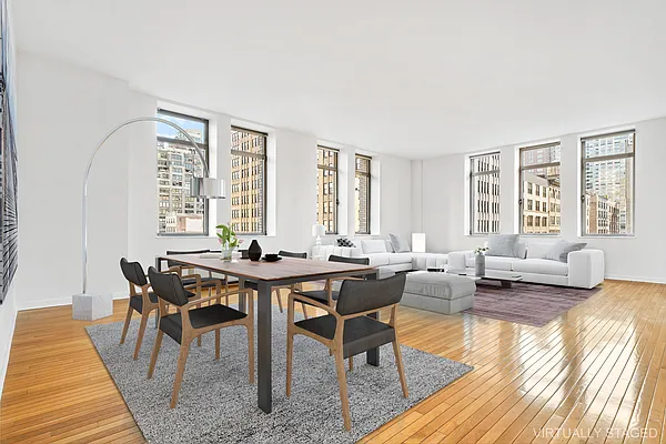 a view of a livingroom with furniture and wooden floor